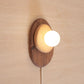 Pebble plug in wall sconce