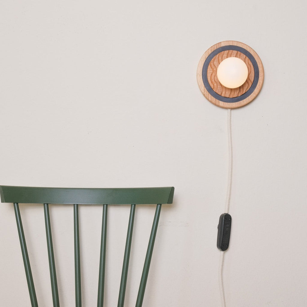 Eddy wall sconce
