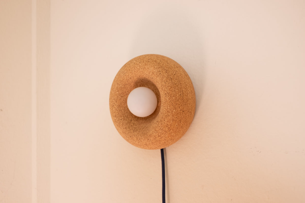 Pesä cork sconce detail showing organic hand-turned form