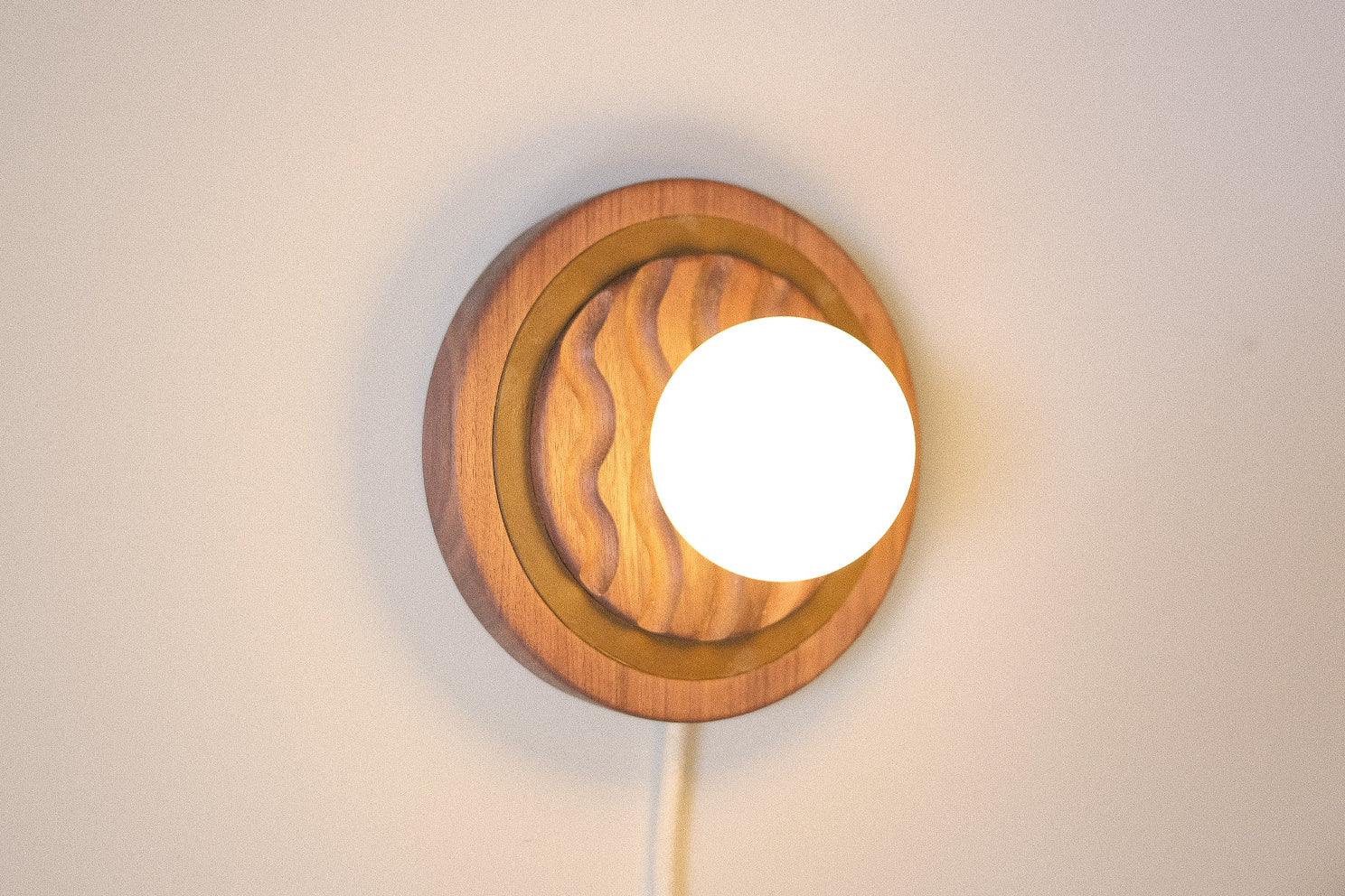 Eddy wall sconce