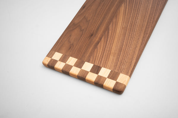 Handcrafted hardwood cutting board checkered pattern detail