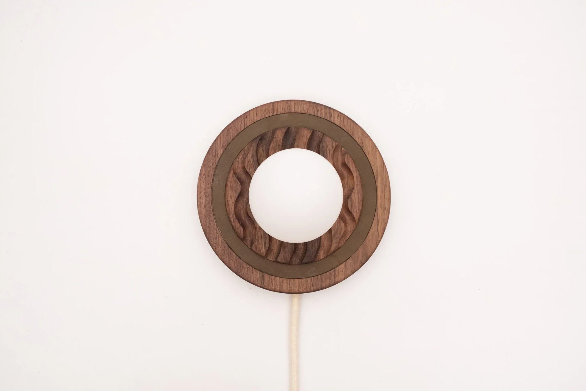 Eddy wall sconce
