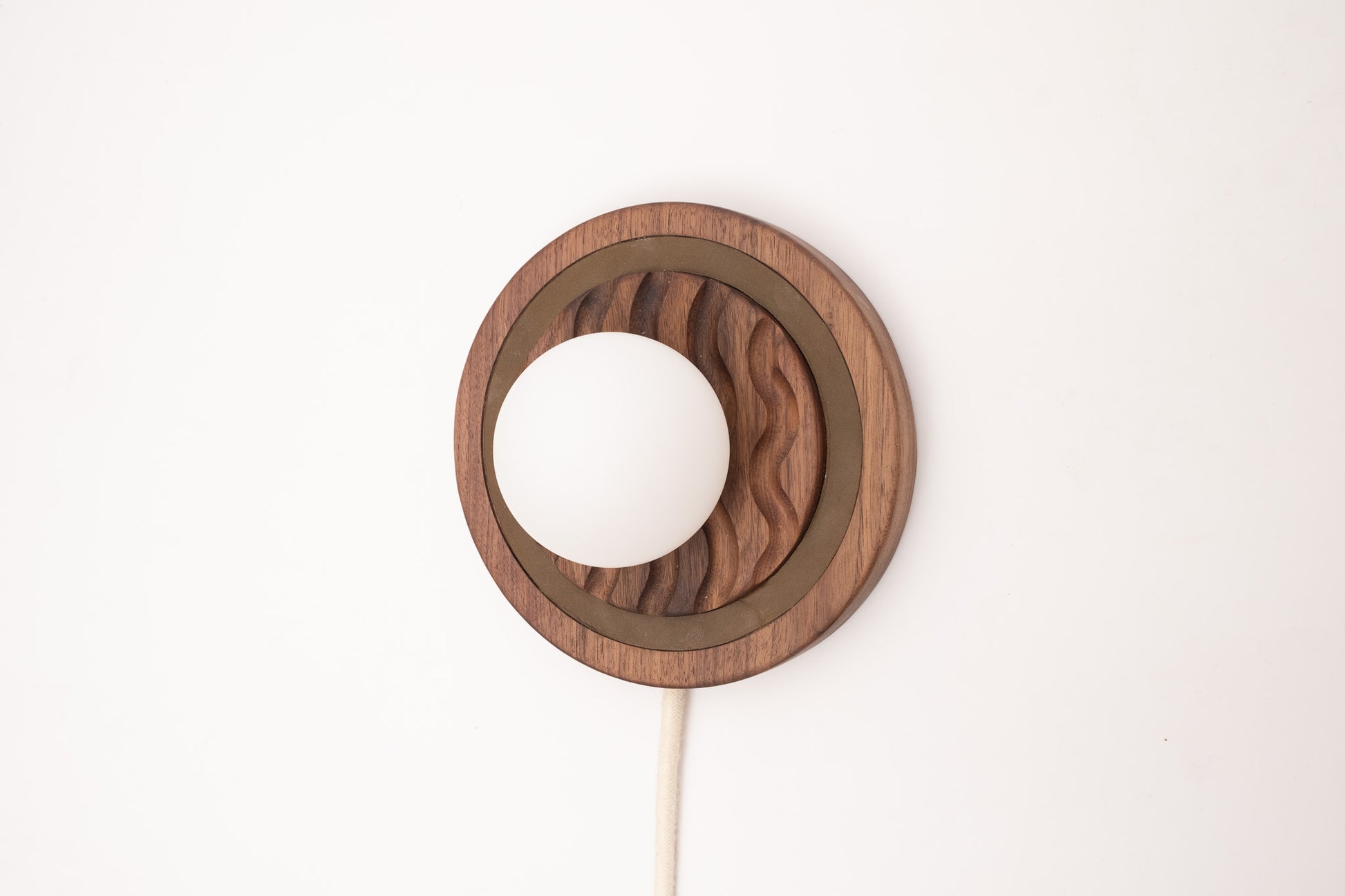 Eddy wall sconce