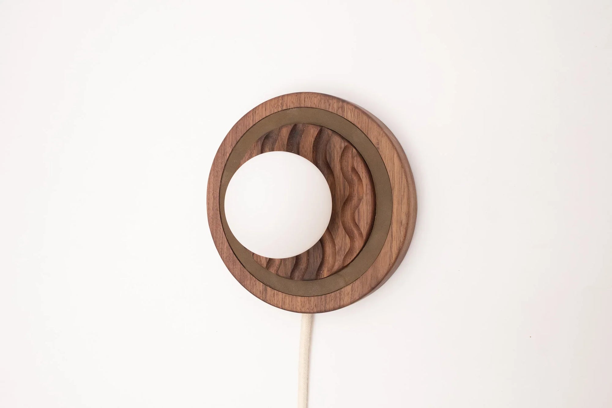 Eddy wall sconce
