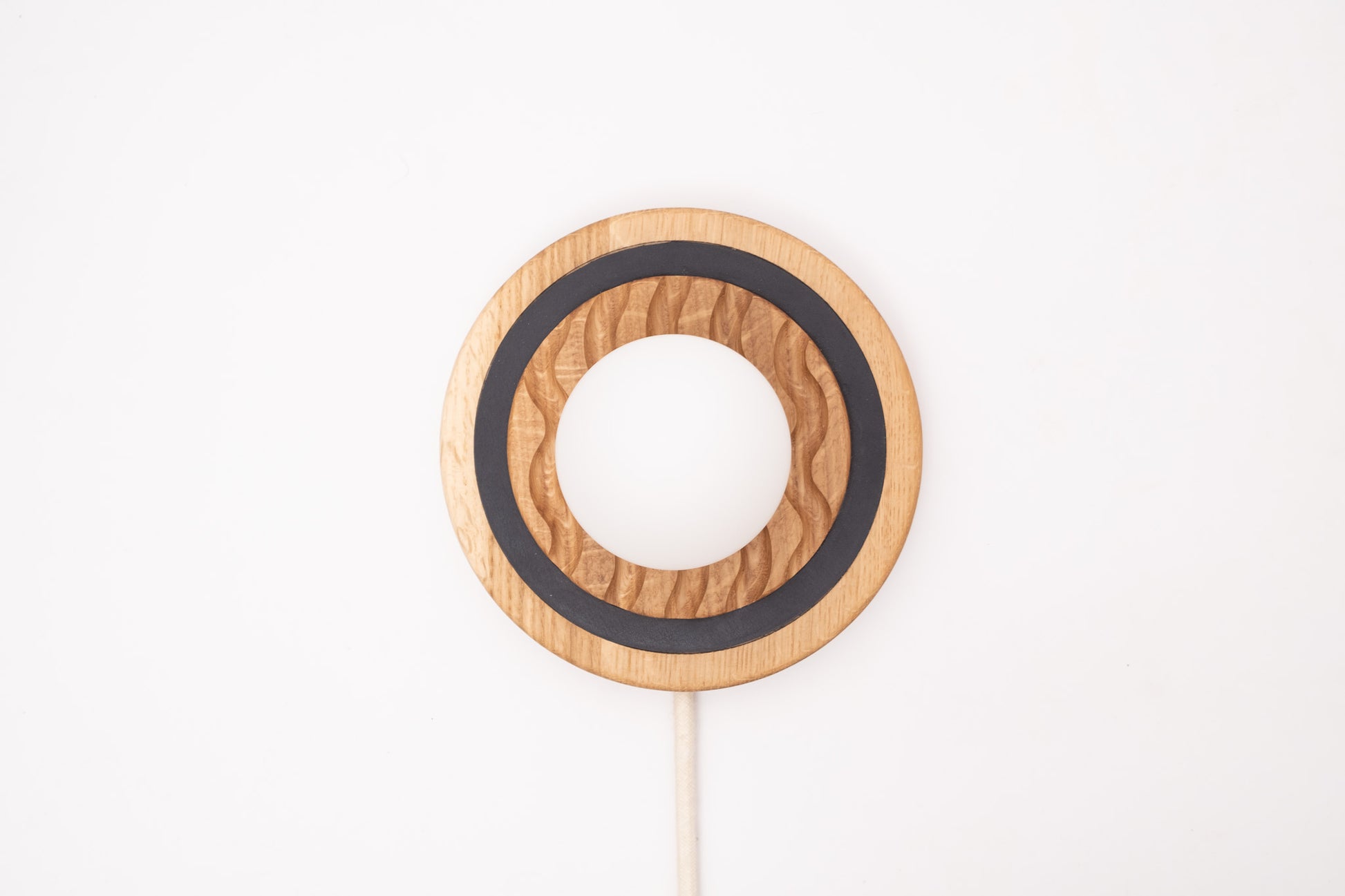 Eddy wall sconce