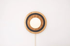 Eddy wall sconce