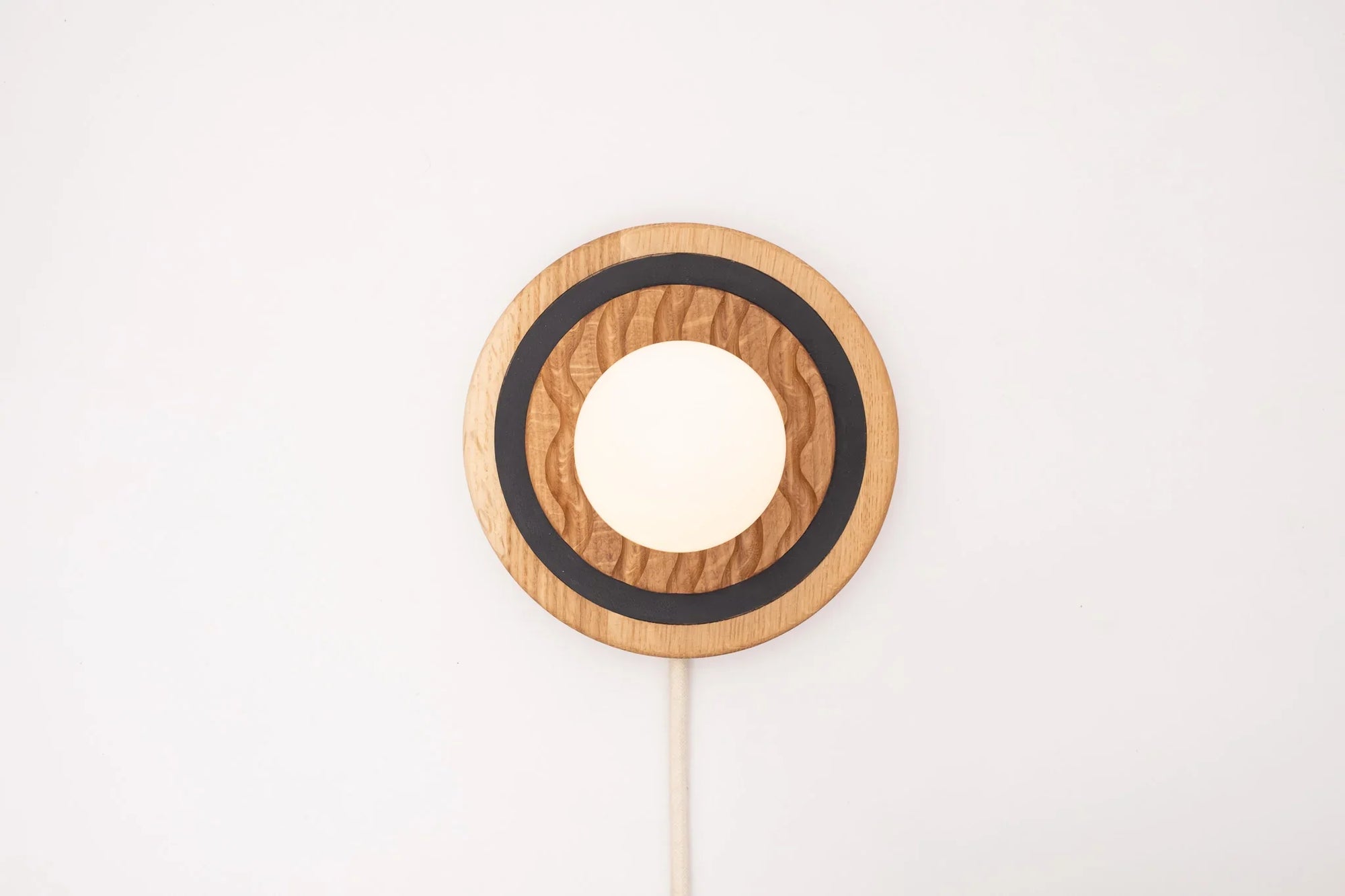 Eddy wall sconce