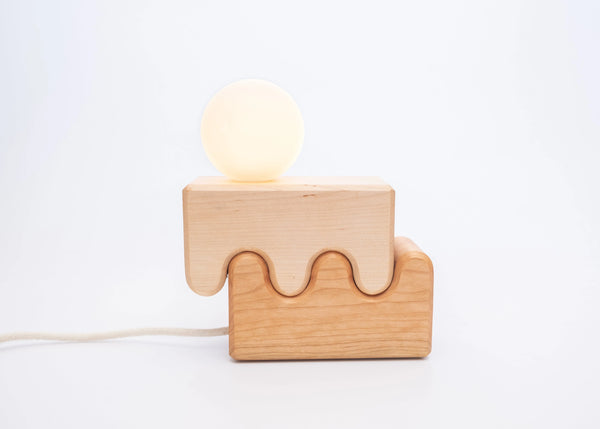 Canyon lamp close up showing sculptural layered wood form