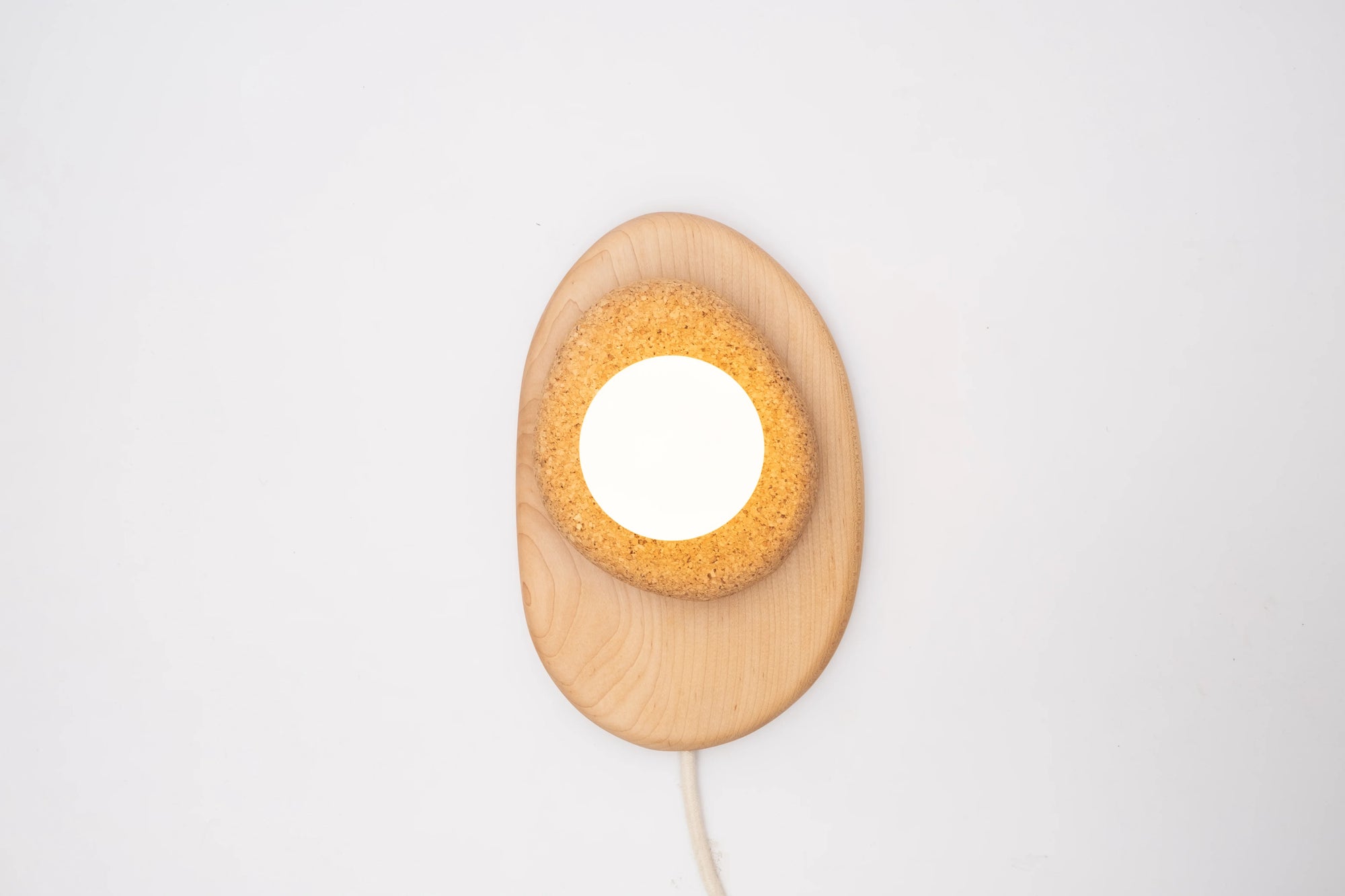 Pebble plug in wall sconce
