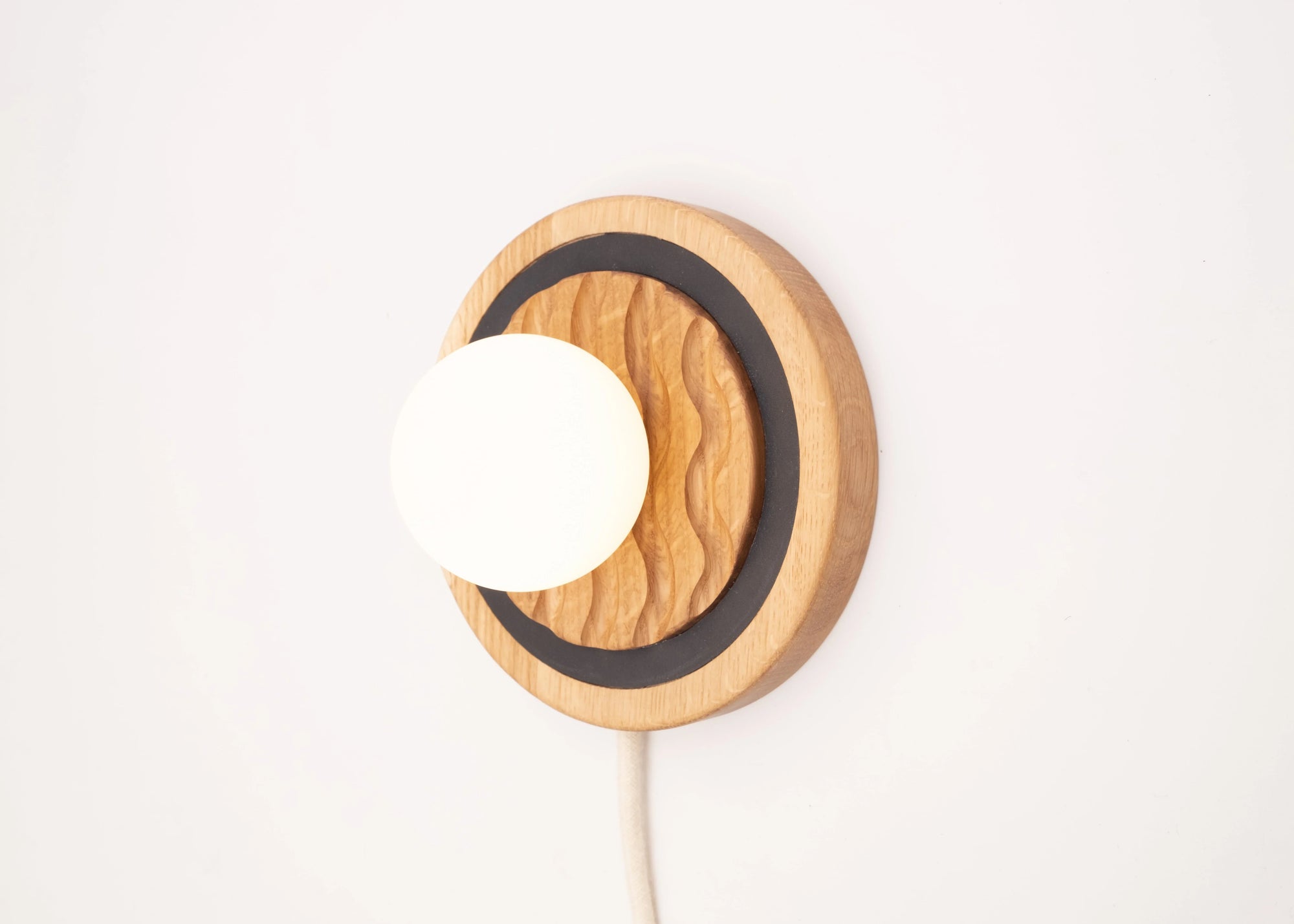 Eddy wall sconce