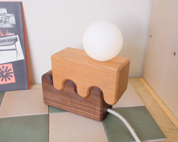 Canyon lamp in bedroom lifestyle setting beside bed