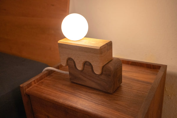 Canyon lamp turned on showing warm 2700K dimmable light on nightstand
