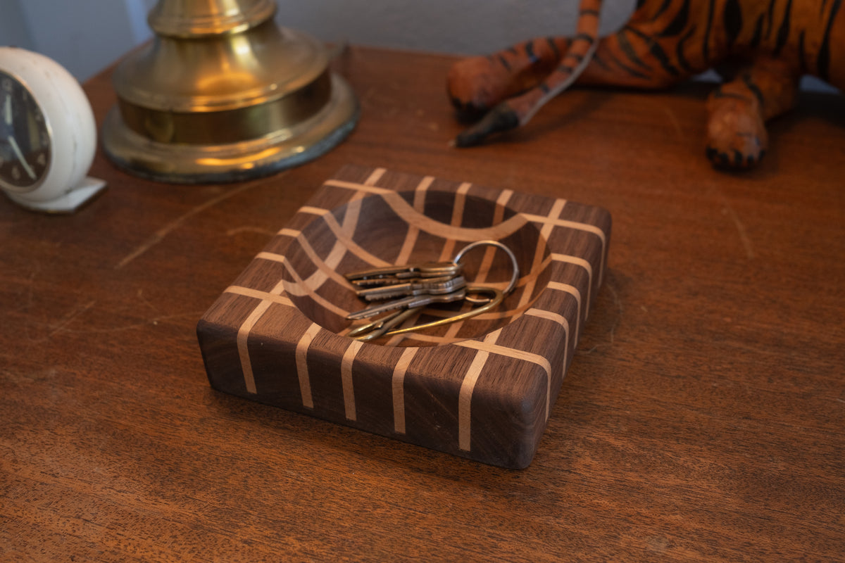 Lattice wood valet tray with keys and small items on modern surface
