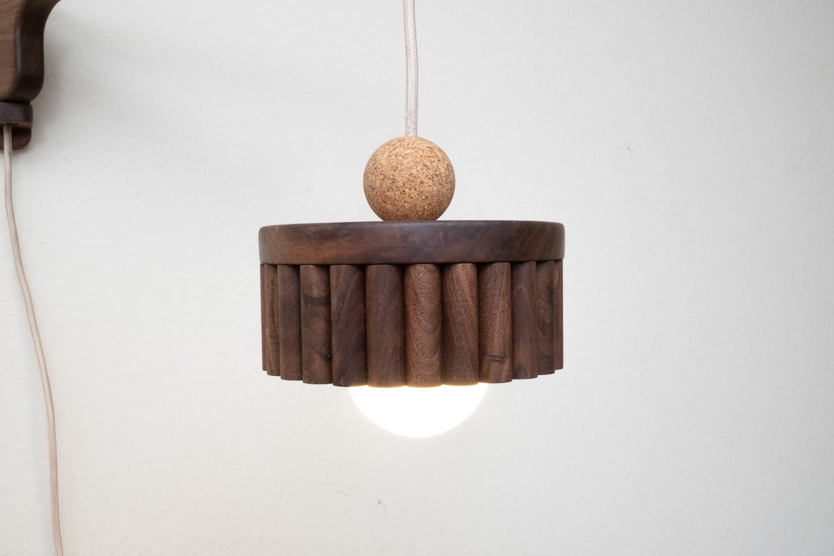 Wall-mounted pendant light in bedroom lifestyle setting