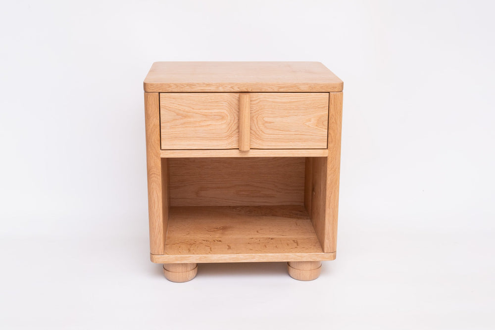 Vertis nightstand drawer detail showing vertical dowel pull
