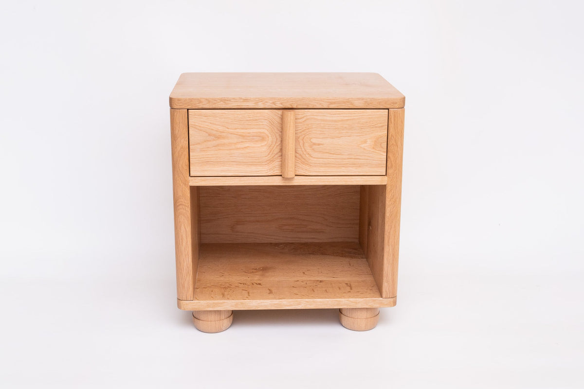Vertis nightstand drawer detail showing vertical dowel pull