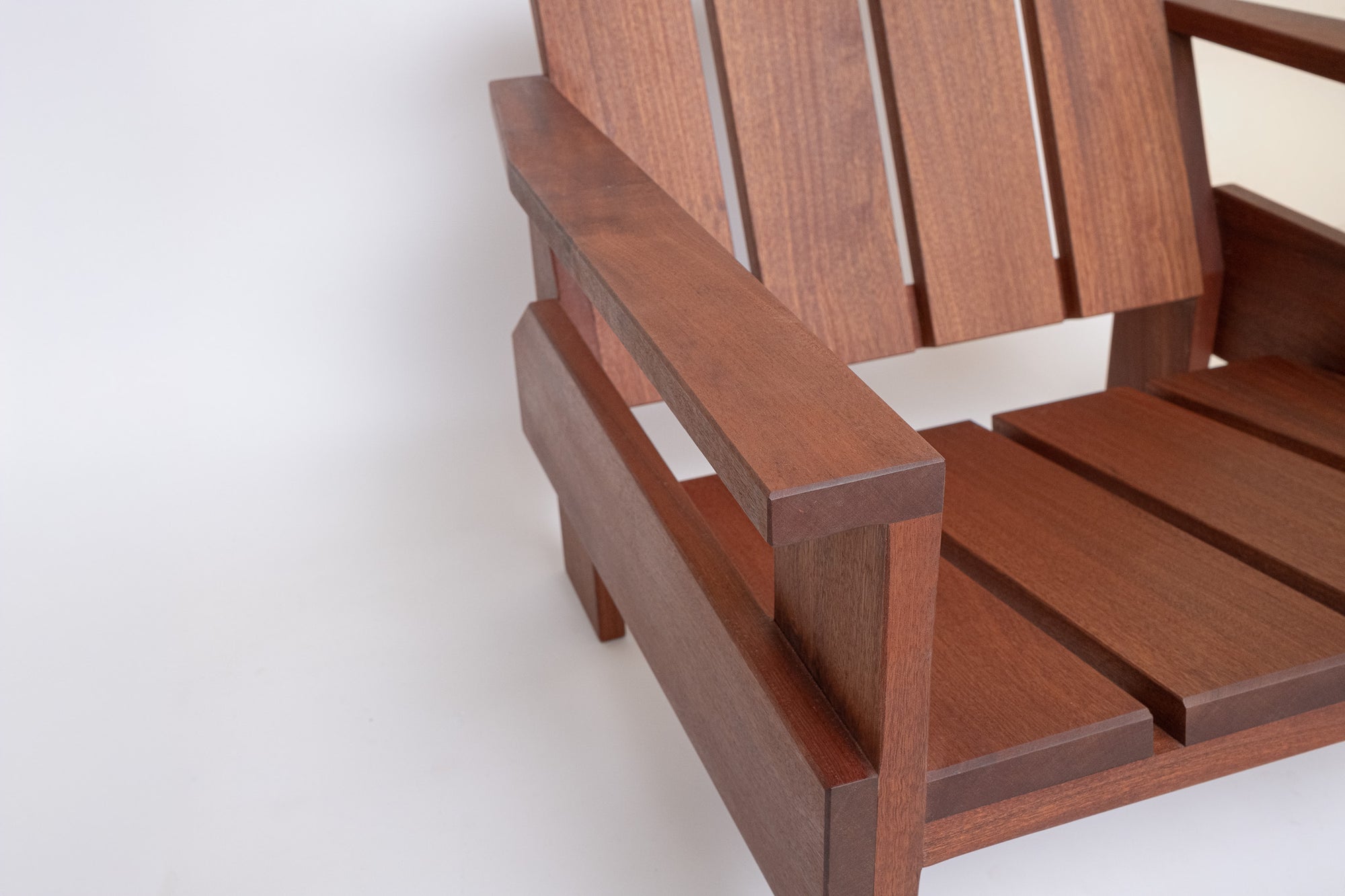 Handcrafted solid wood fire pit lounge chair in outdoor setting