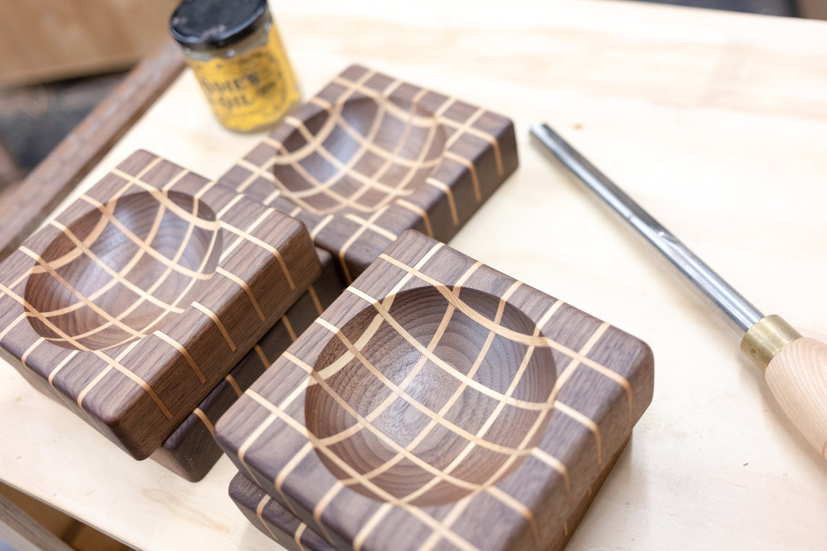 Walnut trinket tray with maple inlay detail close up