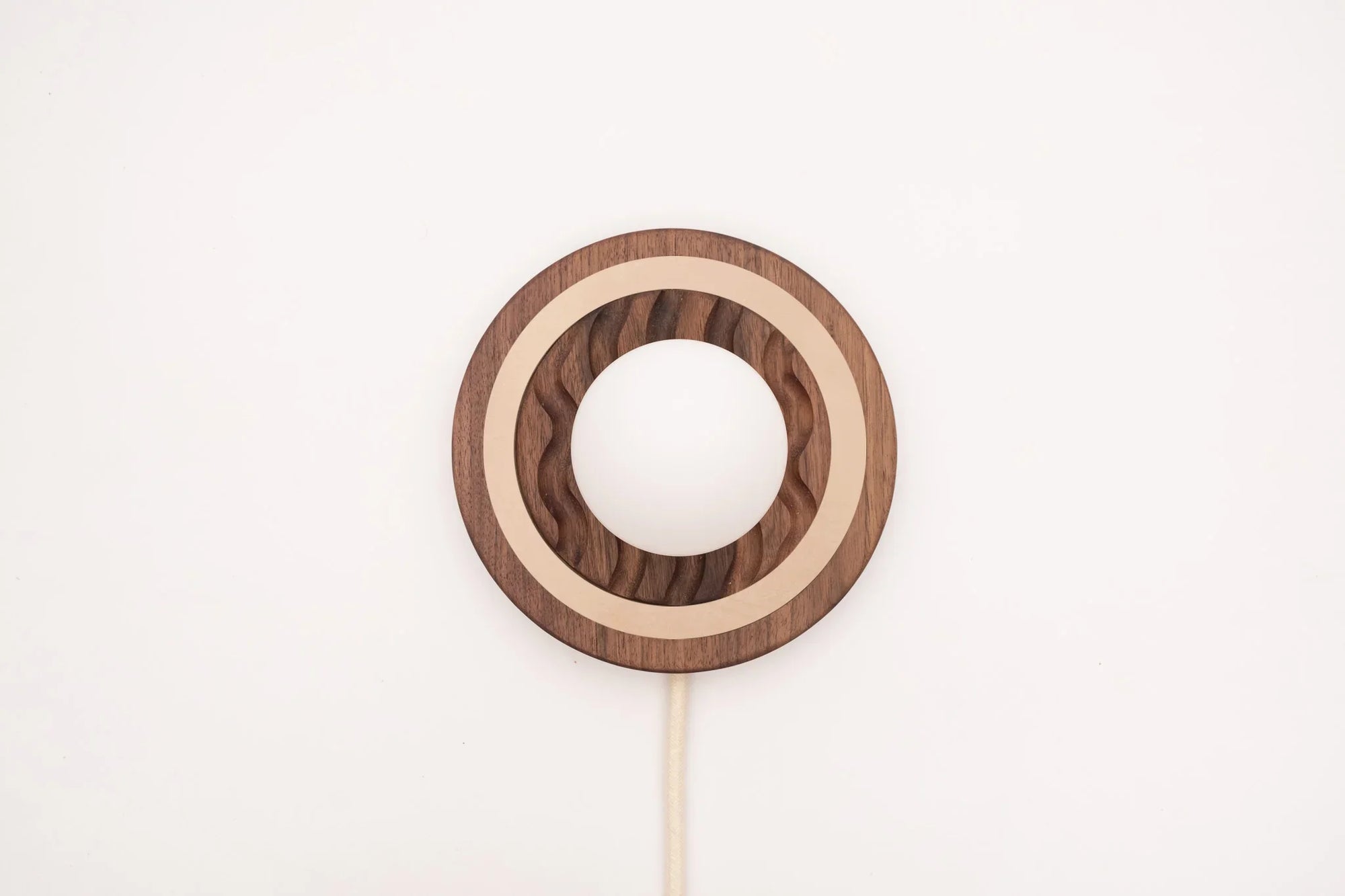 Eddy wall sconce