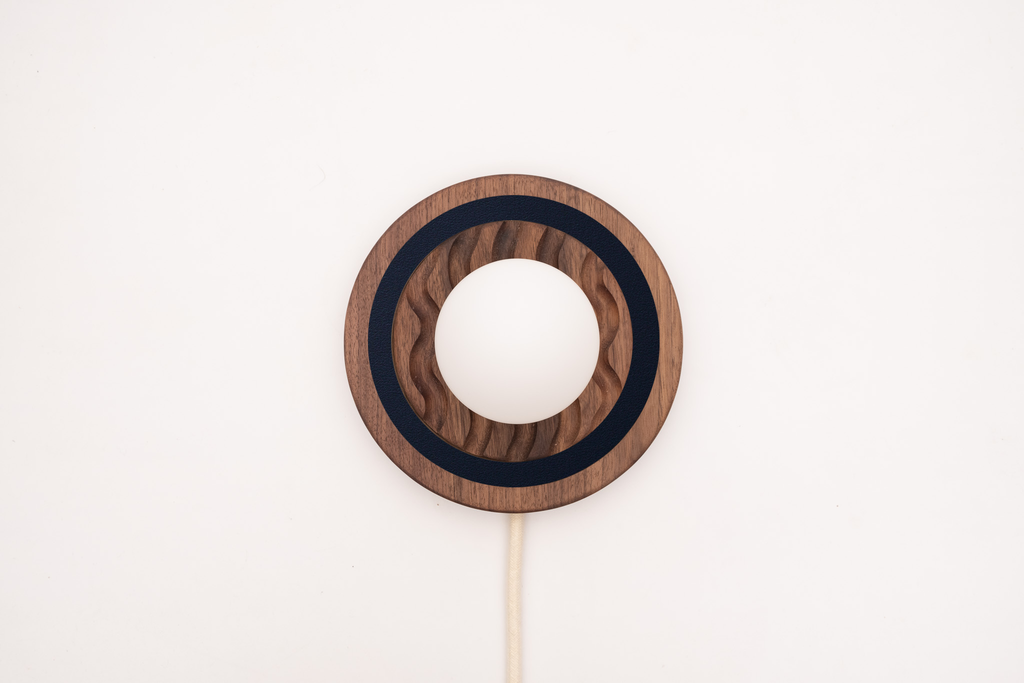 Eddy wall sconce