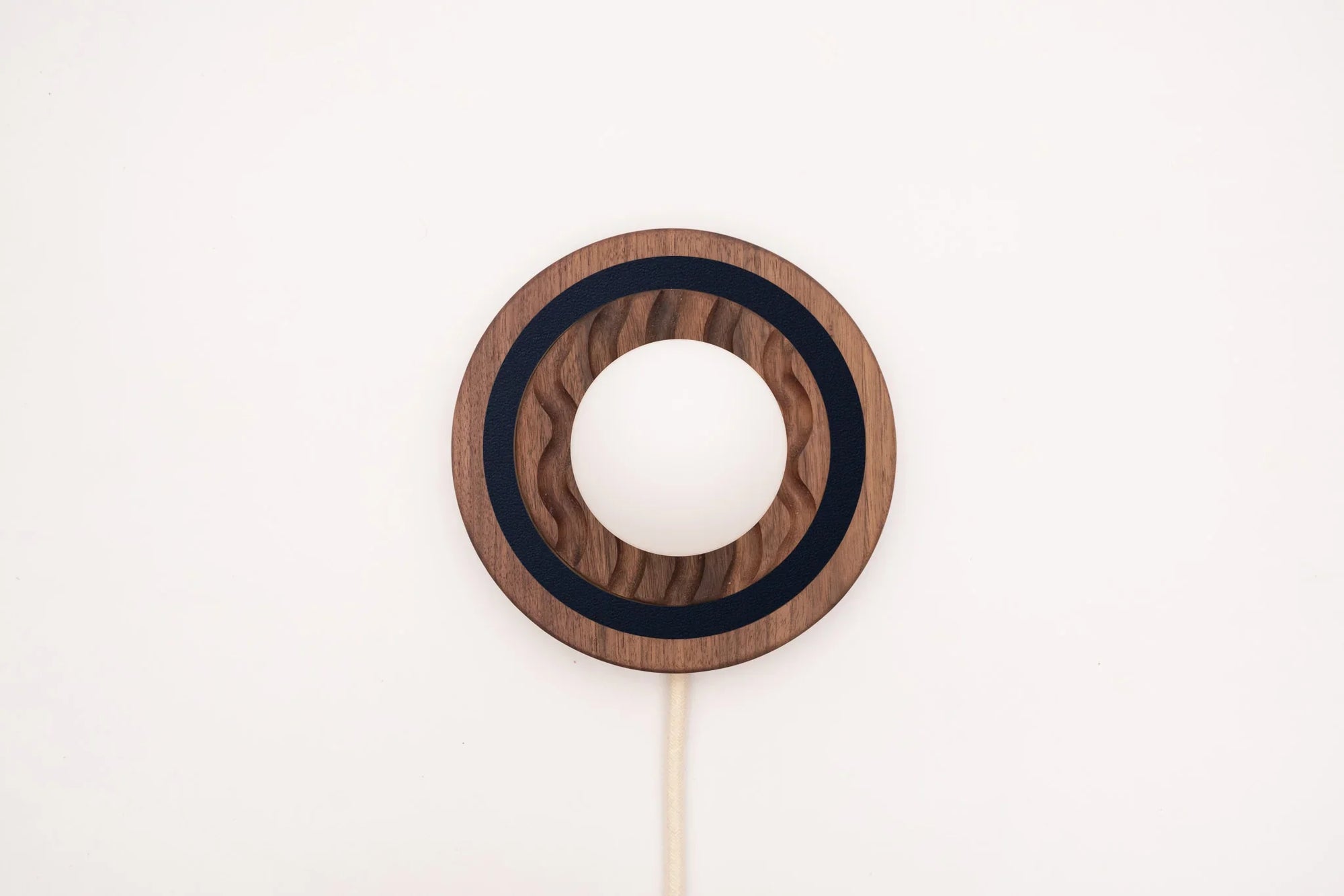 Eddy wall sconce