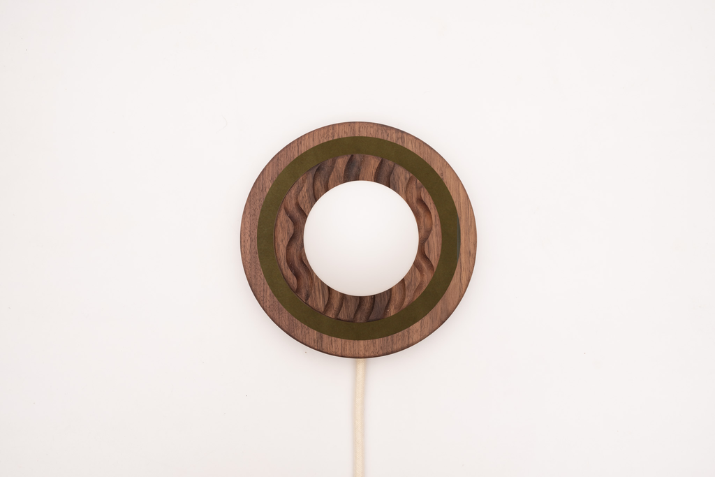 Eddy wall sconce