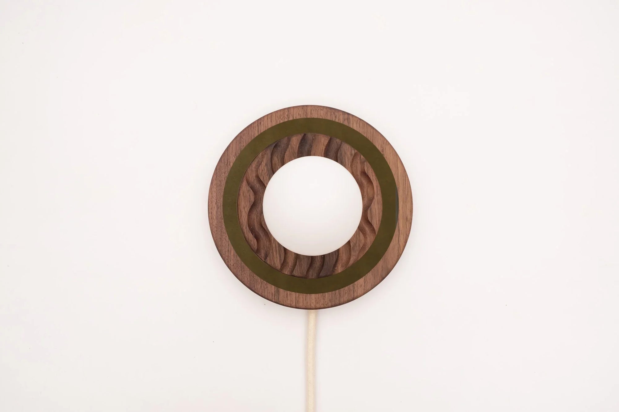 Eddy wall sconce