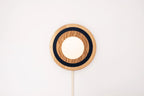 Eddy wall sconce