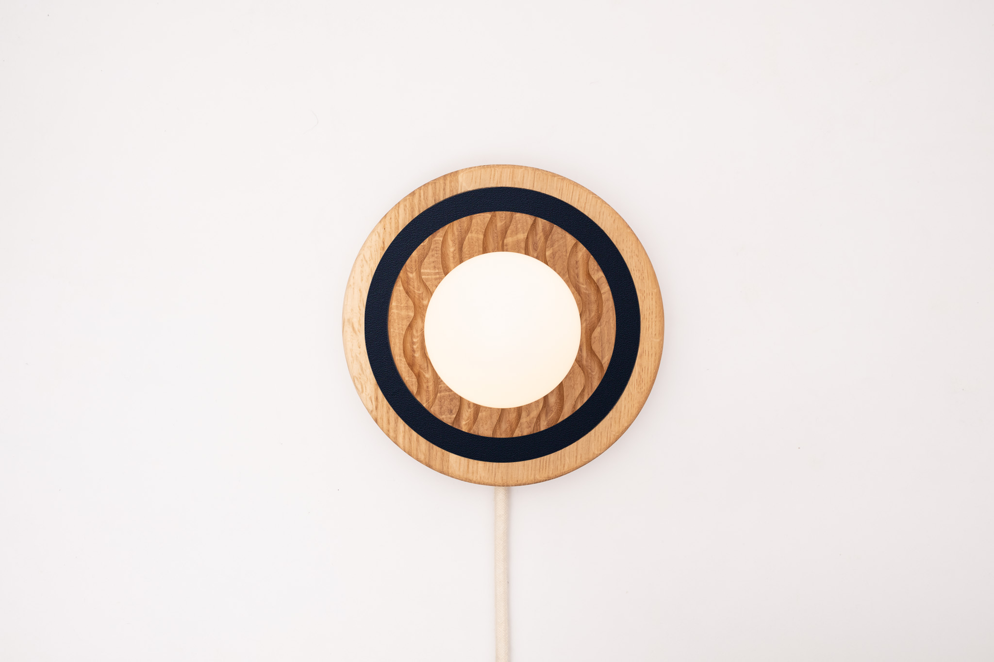 Eddy wall sconce