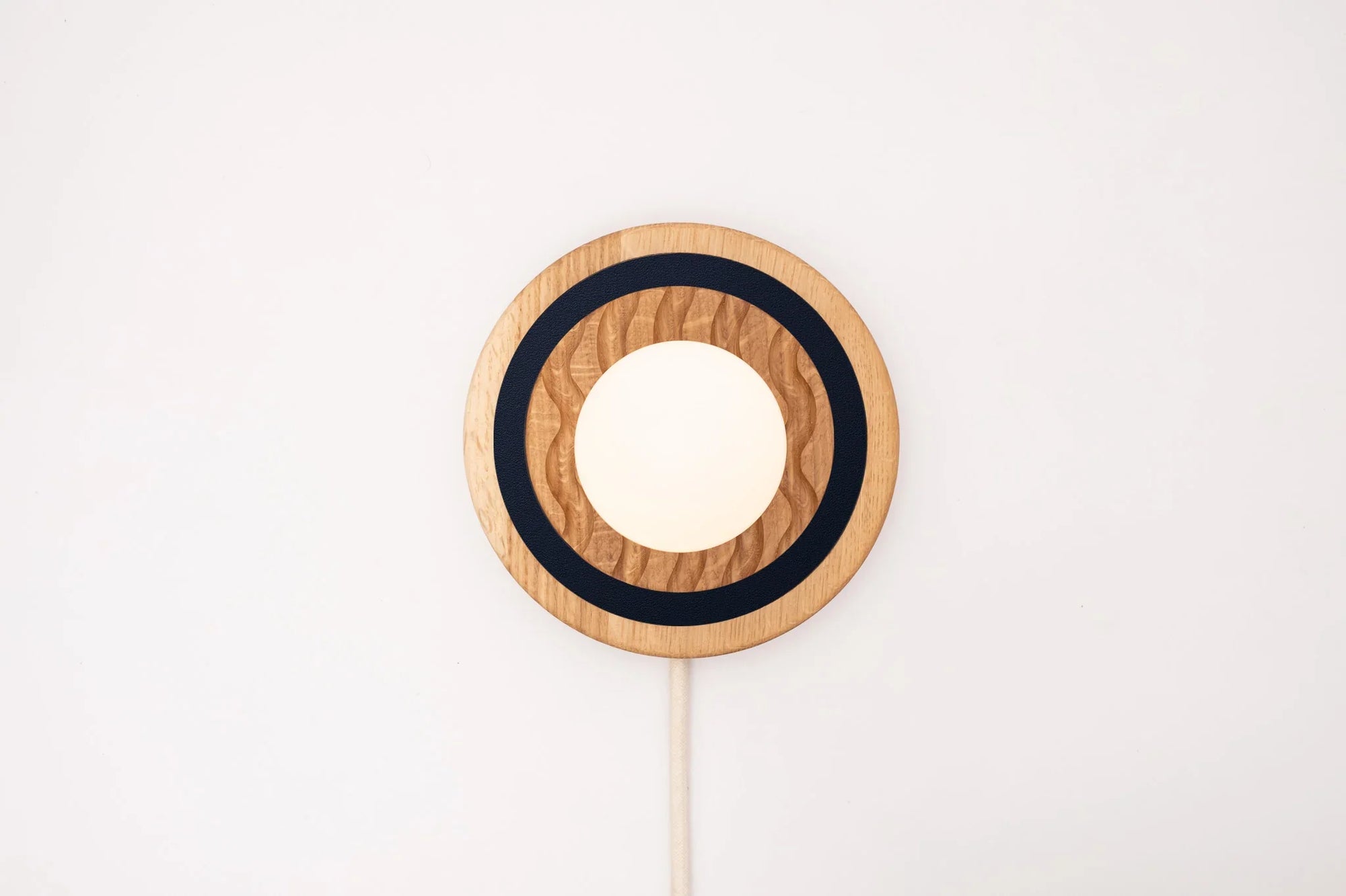 Eddy wall sconce