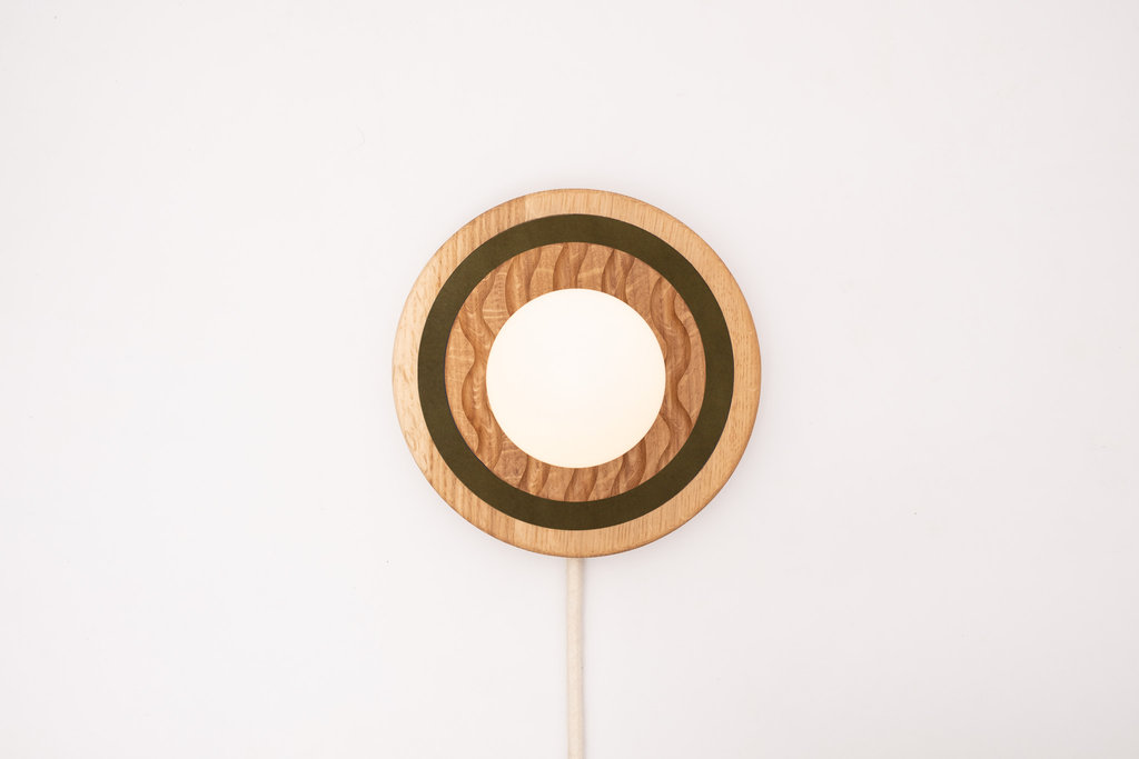 Eddy wall sconce