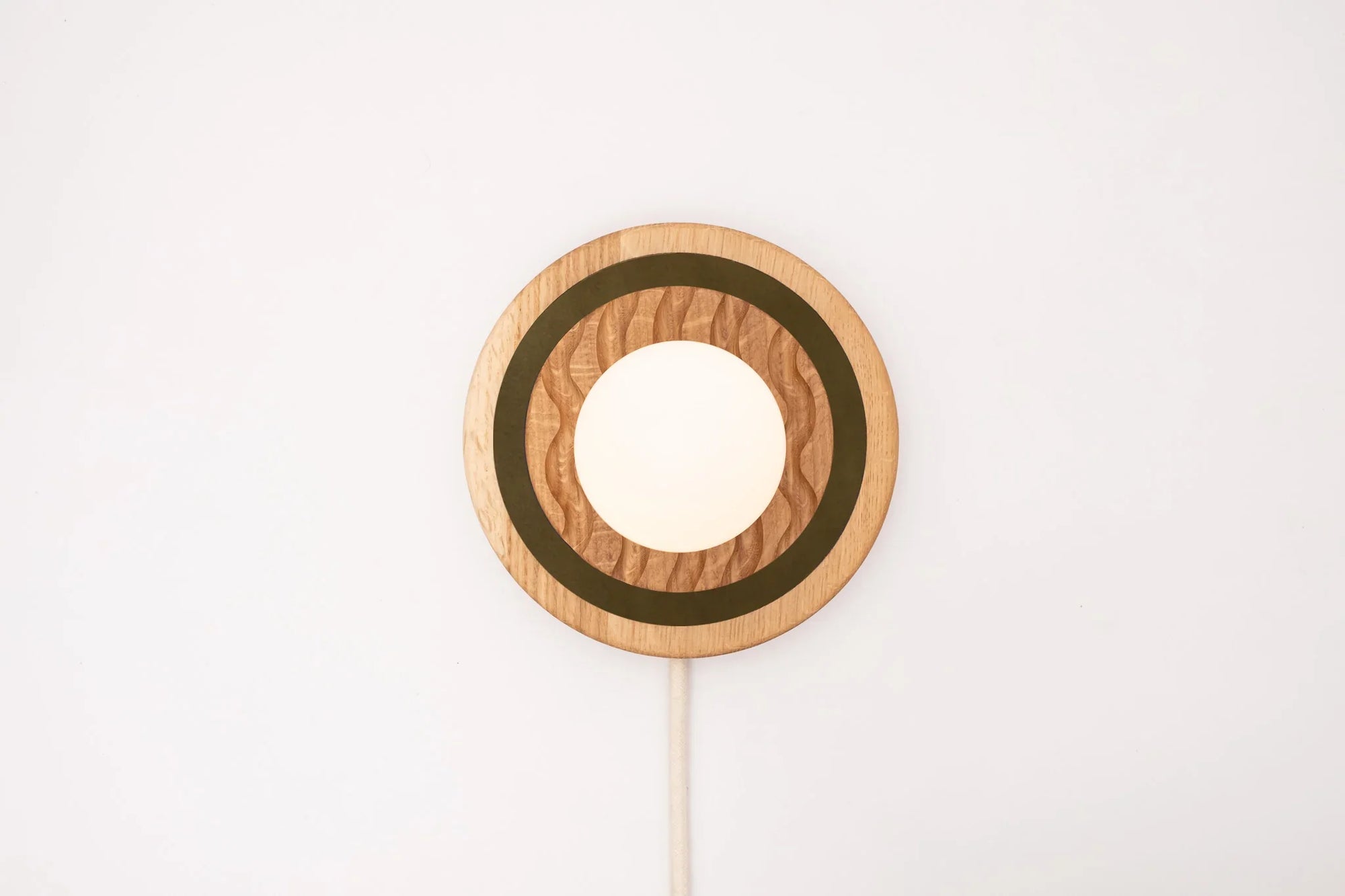 Eddy wall sconce