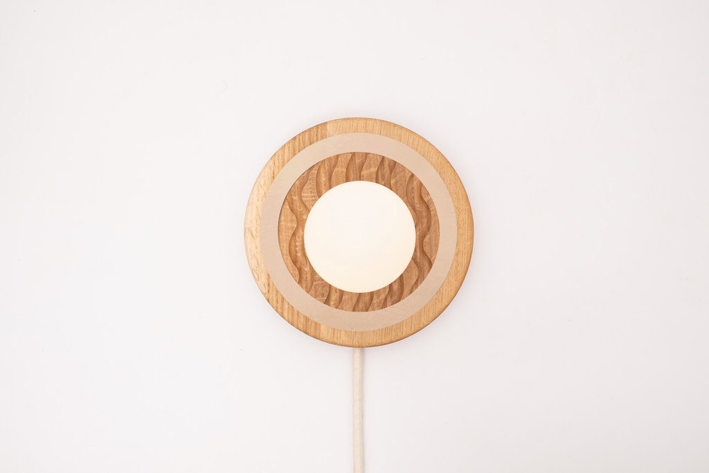 Eddy wall sconce