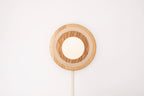 Eddy wall sconce
