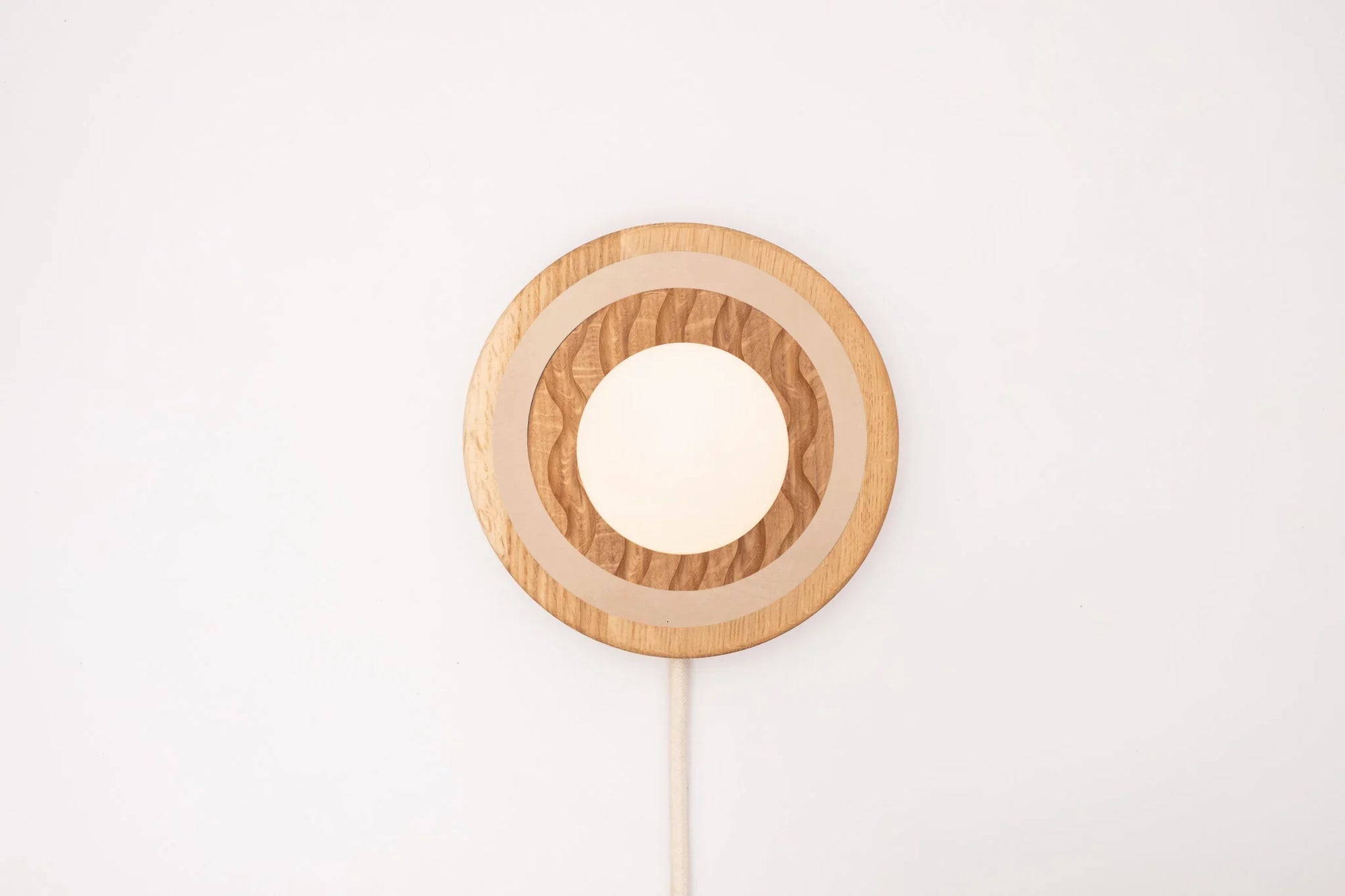 Eddy wall sconce