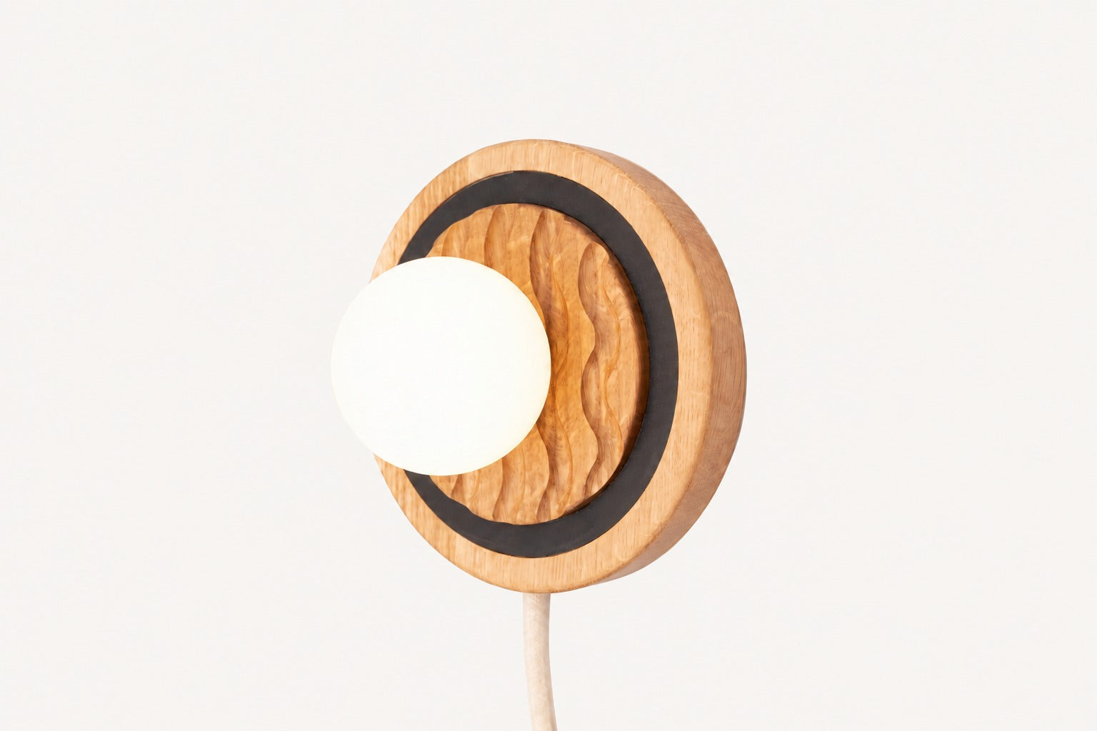 Eddy plug-in wall sconce sculptural wood form handmade by Koppa Wood Design