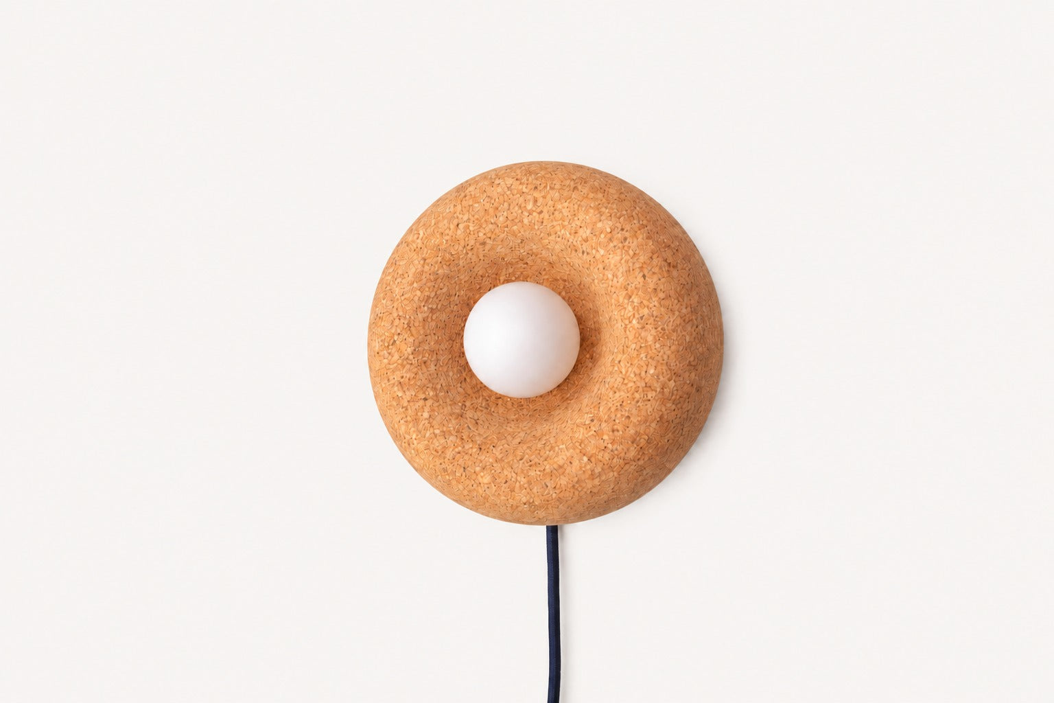 Pesä cork plug-in wall sconce hand-turned natural cork by Koppa Wood Design